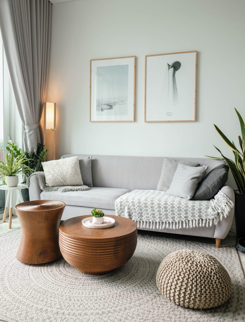 2023 Decorating Trends using textures, wood, woven items, and plants mixed with gray. 